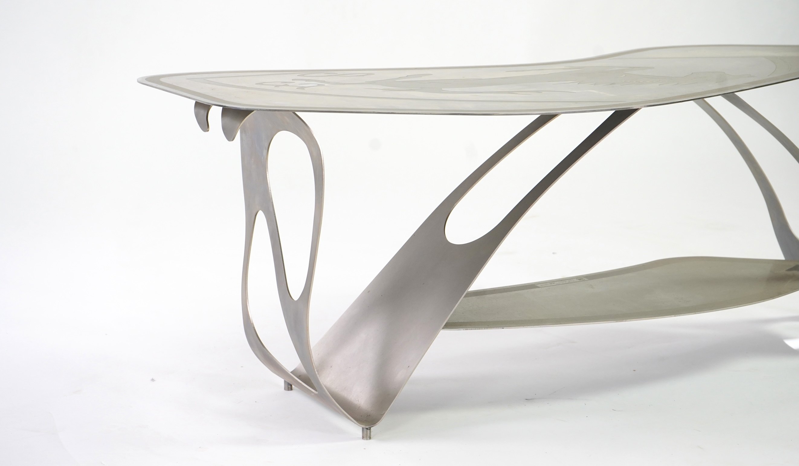 Pietro Psaier (Italian 1939-2004) A Ferrari polished steel coffee table, 1 of 3, in homage to Carlo Mollino